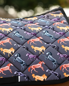 Close crop of the Horse Skeletons print: orange, purple and teal skeletons over grey quilting