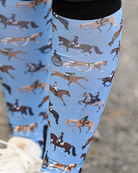 Close crop of the The Pony Island Horse Sports boot sock print, riders mounted across every discipline on light blue