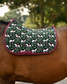 Lippizan Horses saddle pad in dark green with white dressage horses and wreaths, shown unsaddled