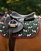 Dark green Lippizan Horses pad with burgundy binding under a brown close-contact saddle and stirrup