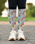 The Pony Island Retro Trailers equestrian boot socks worn at the barn, mint green with vintage horse trailers