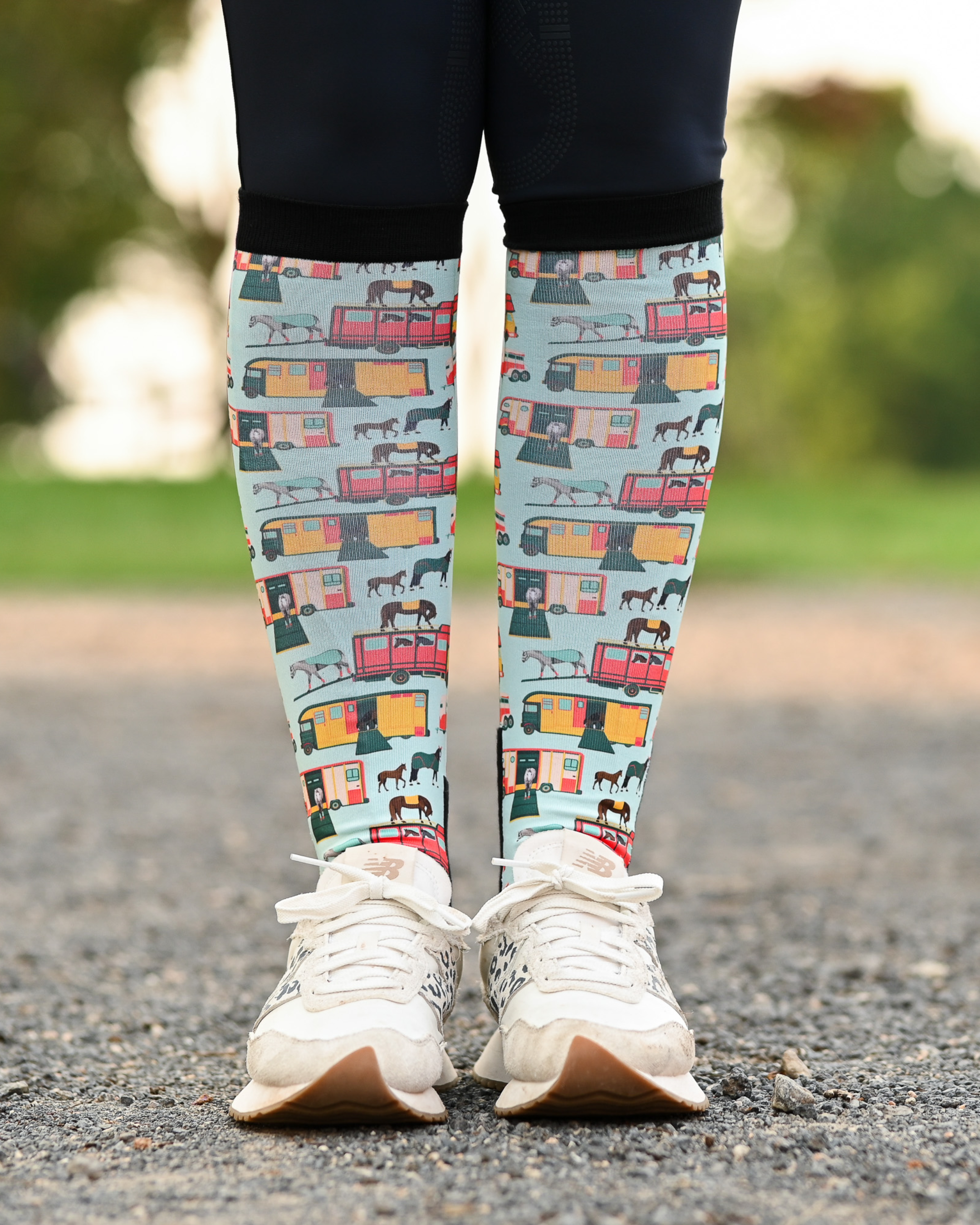The Pony Island Retro Trailers equestrian boot socks worn at the barn, mint green with vintage horse trailers