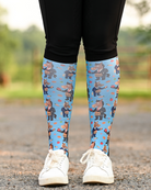 Treat Tax boot socks seen from the front, bright blue ground scattered with horses in business suits paying the treat tax