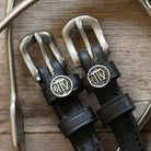 Virgo Spur Straps black leather with stainless steel buckle and Virgo charm close-up