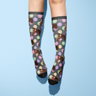 Custom solo socks with smiley face pattern and horse photo design on gray background worn on legs